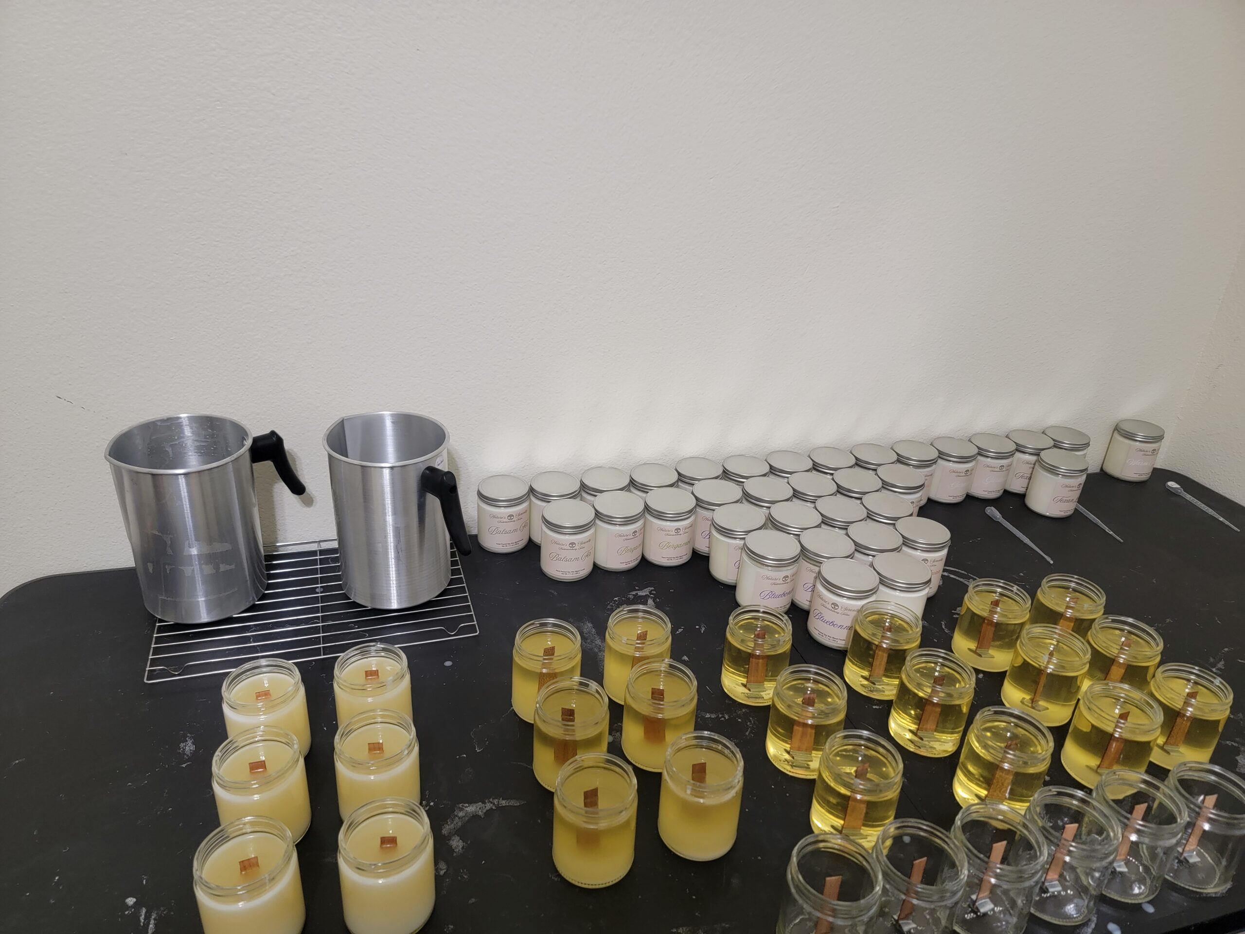 Small-batch Nature's Serenity candles being hand-poured and wicked in Fredericksburg, Texas