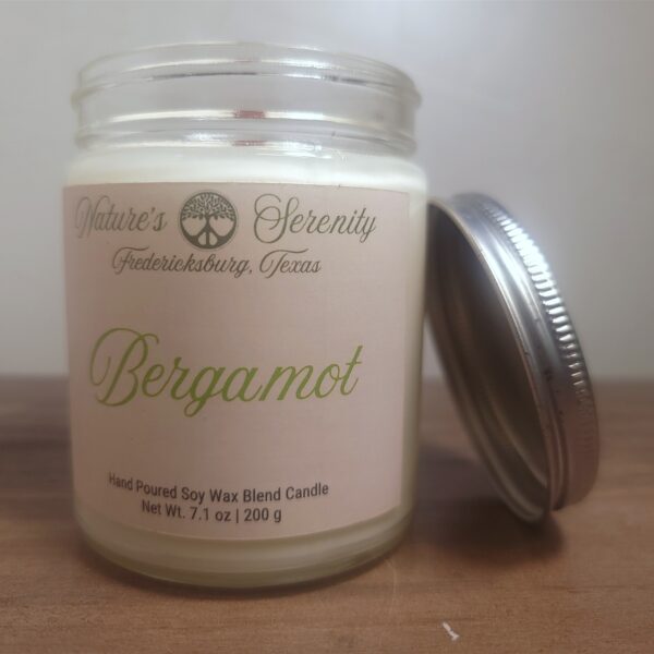 Open Bergamot soy wax blend candle with wooden wick and metal lid