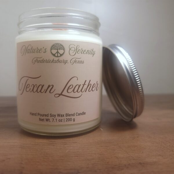Open Texan Leather soy wax blend candle with wooden wick and metal lid